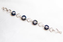 728.q Metallic blue donut link bracelet
